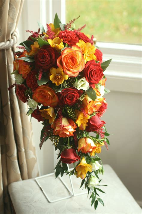 Autumn teardrop bouquet with roses, freesia, eustoma, dianthus, astilbe ...