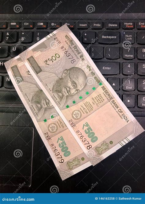 Five Hundred Rupees Indian Currency Notes on a Laptop Keyboard Stock ...