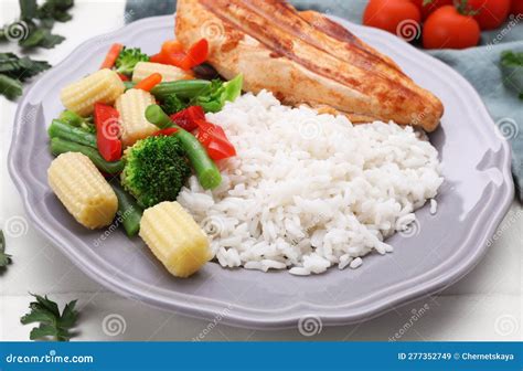 Grilled Chicken Breast and Rice Served with Vegetables on White Table ...