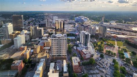 The City Skyline at Sunset with Mercedes-Benz Stadium, the SkyView ...