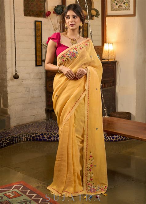 Beautiful yellow cotton saree highlighted with multicolor floral embro ...