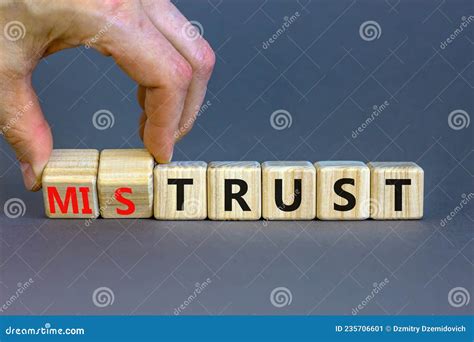 Mistrust or Trust Symbol. Businessman Turns Wooden Cubes, Changes Words ...