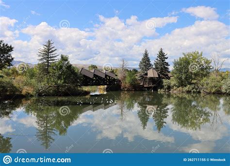 Beautiful View of Wooden Houses and Trees Reflected in a Lake in the ...