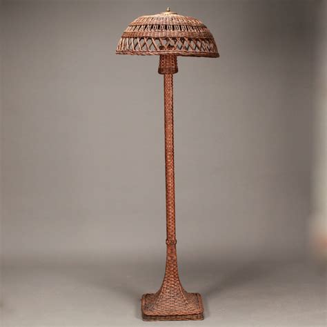 LOT 067 ANTIQUE WICKER FLOOR LAMP WITH WICKER SHADE. 70″(H)
