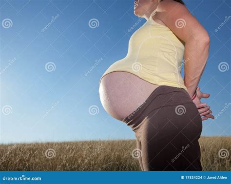 Young Pregnant Woman with Huge Belly Stock Photo - Image of peaceful ...