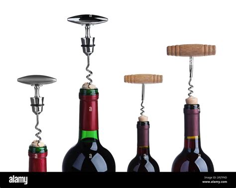 Opening bottles of wine with corkscrews on white background Stock Photo ...