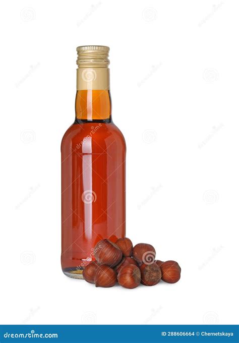 Bottle of Delicious Syrup for Coffee and Hazelnuts Isolated on White ...