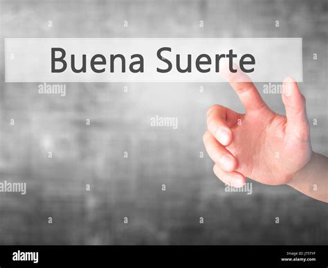 Buena Suerte ( Good Luck in Spanish) - Hand pressing a button on ...