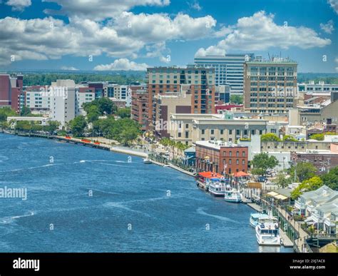 Aerial view of Wilmington North Carolina historic district along the Cape Fear river with cloudy ...