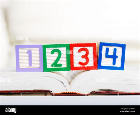 Alphabet block with 1234 on book Stock Photo - Alamy