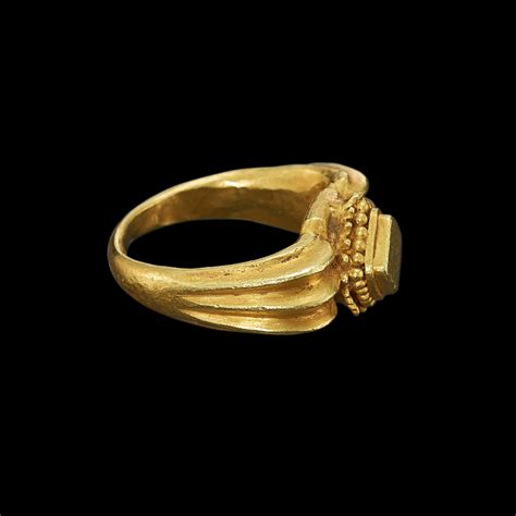 A solid gold ring with vertical rib shank Java, Indonesia, 7th-12th ...