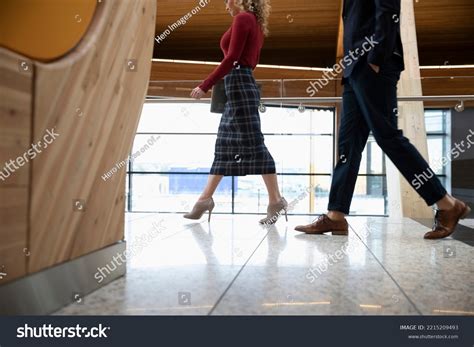 Two Business People Walking Side by Side 的图像结果