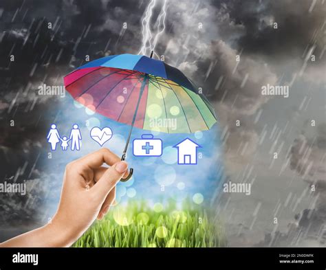 Insurance agent protecting illustrations with rainbow umbrella from ...
