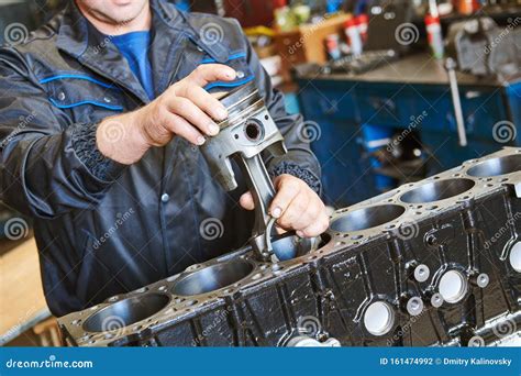 Diesel Truck Engine Repair Service. Automobile Mechanic Installing ...