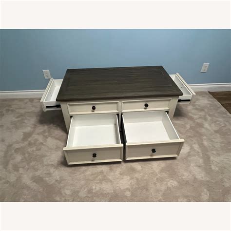 Ashley Bolanburg Wood Lift Top Coffee Table - Four Drawers - AptDeco