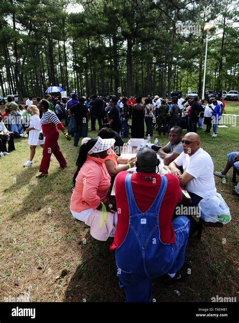 Protesters fill a grassy area adjacent to the Georgia Diagnostic and ...