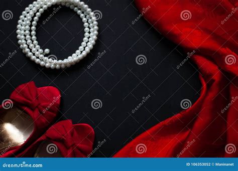 Red Shoes, Pearl Necklace, Silk Handkerchief on a Black Background ...