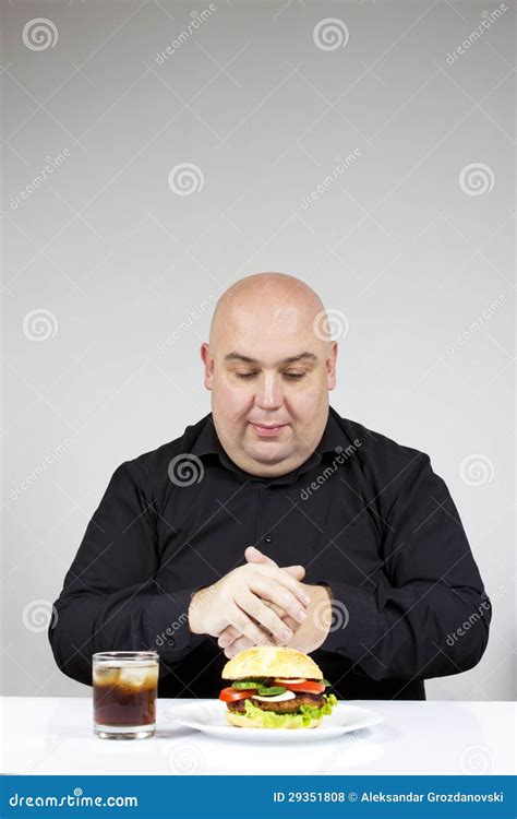 Fat man eating burger stock photo. Image of holding, junk - 29351808