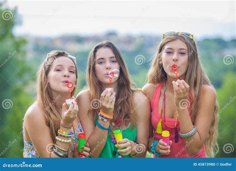 Teenagers with Bubble Pipes Stock Photo - Image of girls, pretty: 45873980