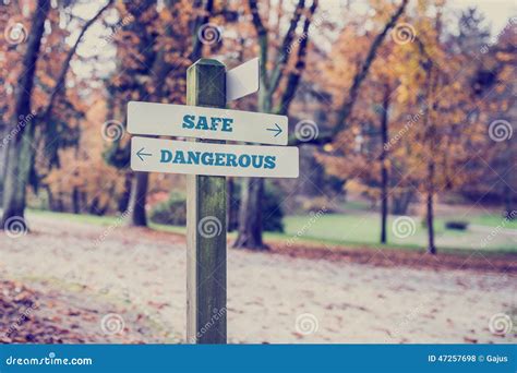 Opposite Directions Towards Safe and Dangerous Stock Photo - Image of ...