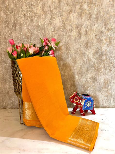 Turmeric yellow pure Georgette saree with zari border – Mandira Silks