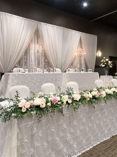Elegant Wedding Head Table Decor with White and Pink Flowers