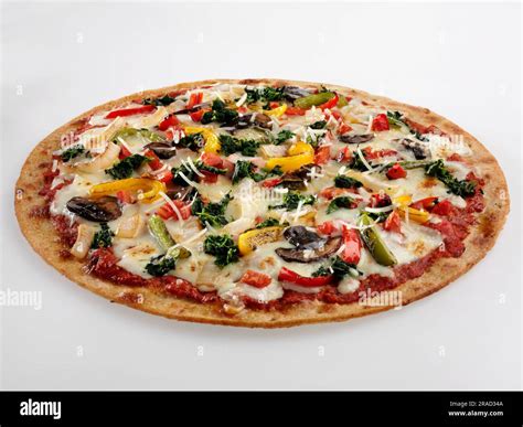 Vegetable pizza with thin crust Stock Photo - Alamy