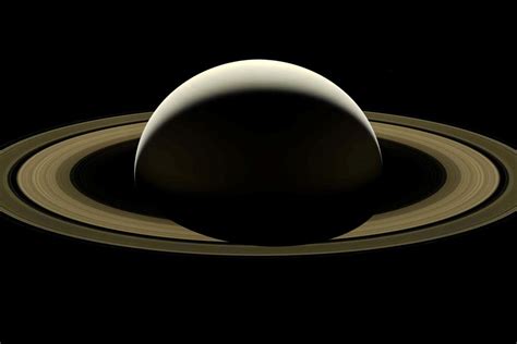 Saturn's rings form a giant dusty doughnut encircling the planet ...