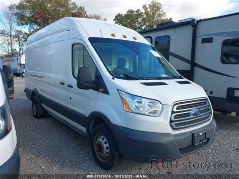 Report 1FTBF4XG5JKA95467 FORD TRANSIT VAN 2018 White Gasoline - price and damage history