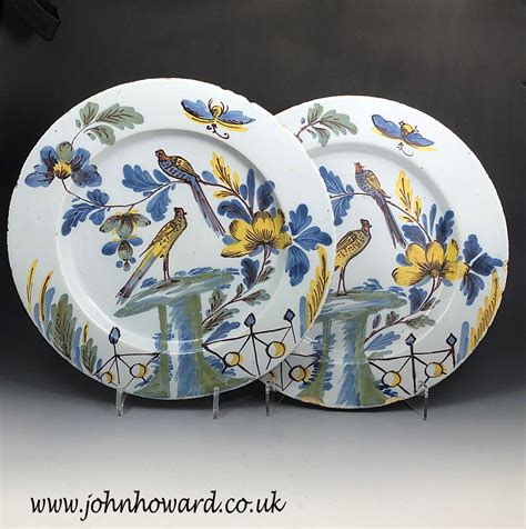A pair of Delftware pottery chargers from the Bristol Delftworks of two ...