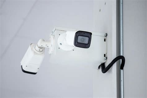 Mounted Surveillance Camera on the Wall · Free Stock Photo