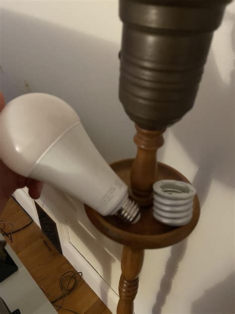 LED bulb with socket adapter in old lamp gets very hot. Is this safe ...