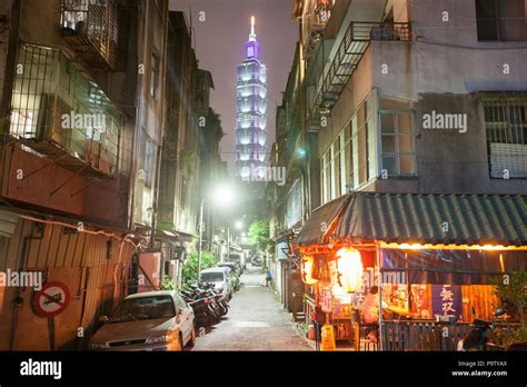 Photo of Taipei 101 tower against a blue sky.