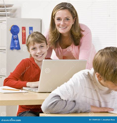 Teacher helping student stock photo. Image of educator - 17049120