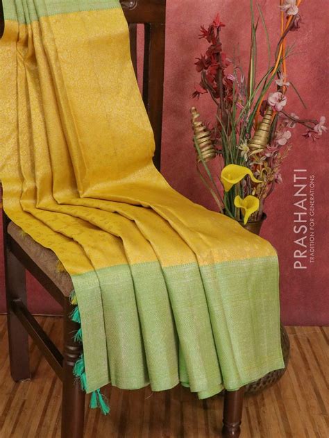 Pure Kanchivaram silk saree yellow and light green with allover floral ...