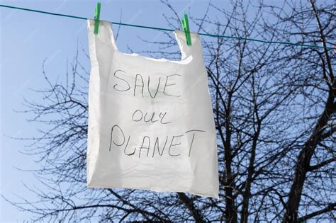 Premium Photo | One plastic bag hang on a wire in the street
