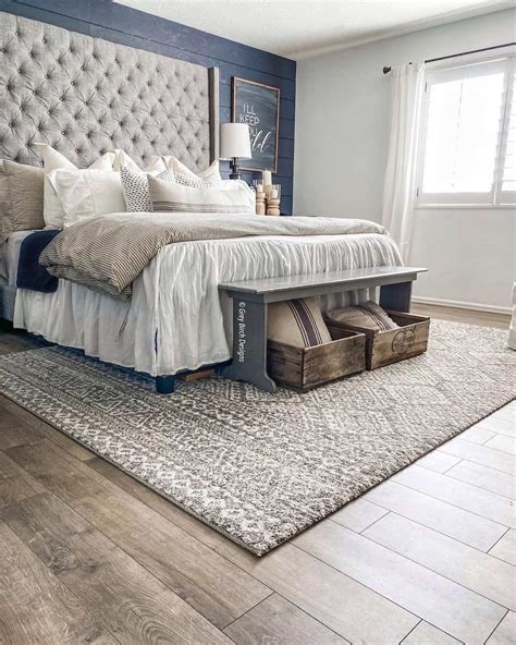 Grey Rug Under Bed on Warm Wood Floor - Soul & Lane