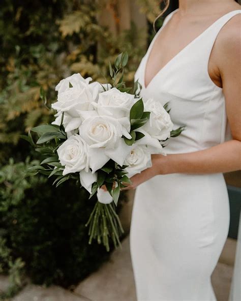 Laura's stunning all White Reflexed Rose Bouquet at Middleton Lodge | White rose wedding bouquet ...