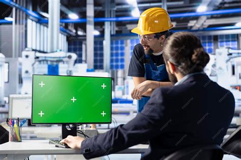 Photovoltaics factory colleagues optimize production flow using mockup ...