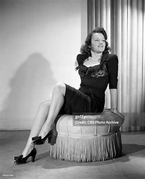 Radio disc jockey, Lois January, the "Reveille Sweetheart," spins ...