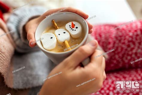 hands with marshmallow snowman in mug on christmas, Stock Photo ...