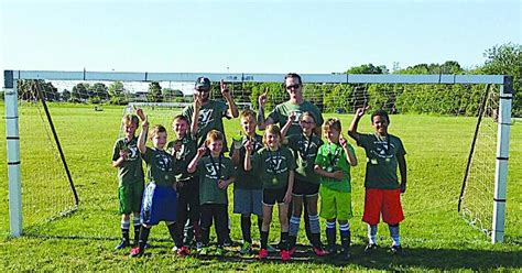 YMCA Military Green Team 17 celebrates first-place finish – Shaw Local