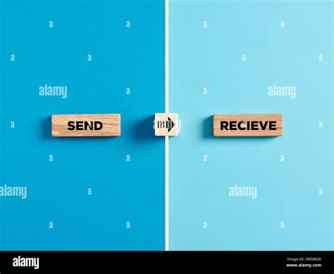 The words send and receive on wooden blocks with arrow direction symbol ...