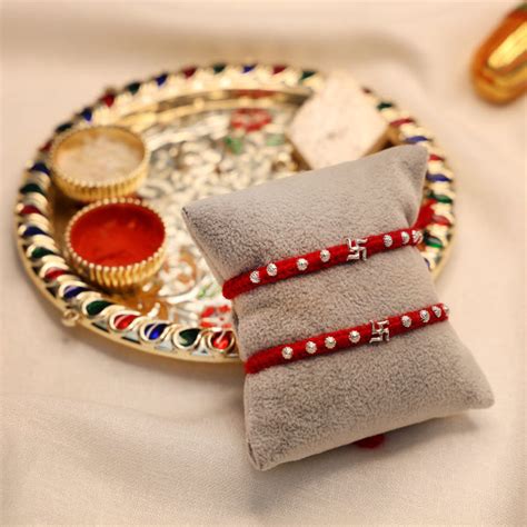 (1 Pc ₹70) Divine Swastika Silver Rakhi Thread – Khushbu Jewellers