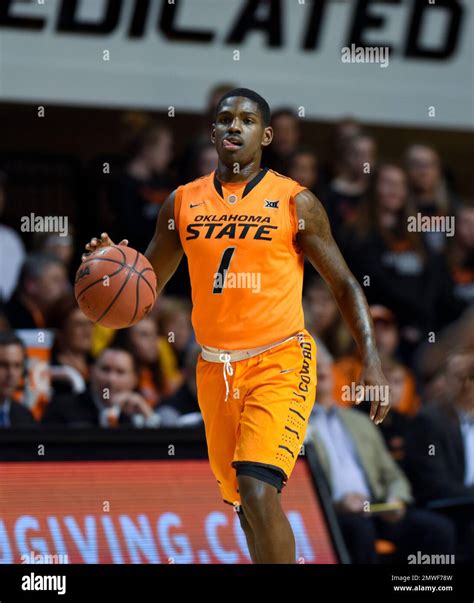 Oklahoma State guard Jawun Evans (1) advances the basketball during a ...
