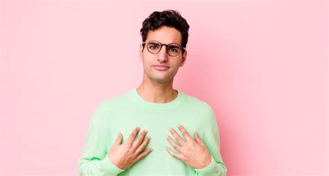 Pointing to self with a confused and quizzical look shocked and ...