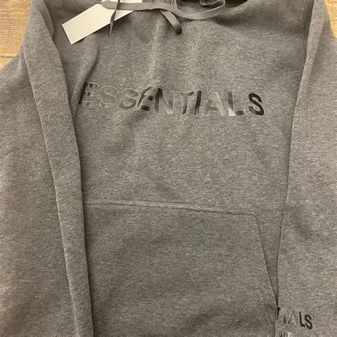 Grey essentials hoodie new with tags - Depop