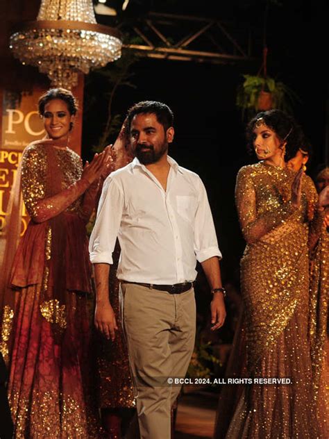 A model showcases a creation by designer Sabyasachi on Day 1 of Delhi ...