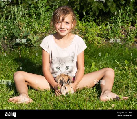 Children playing with pet rabbit hi-res stock photography and images ...