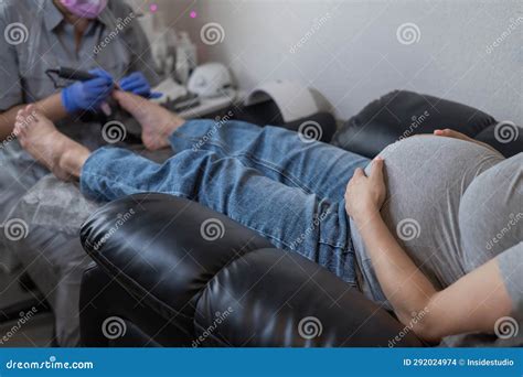 Pregnant Woman on a Hardware Pedicure Procedure in a Beauty Salon ...